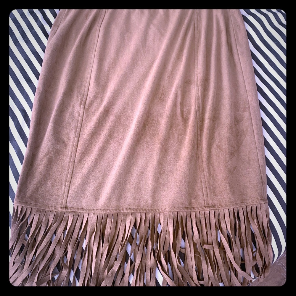 Suede-like knee length fringe skirt.
